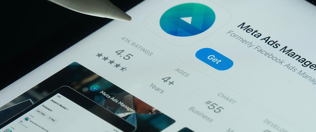 Meta Advertising | Evok Advertising App store listing for Meta Ads Manager on a tablet showing a blue Get button and a 45 star rating with a play icon above it