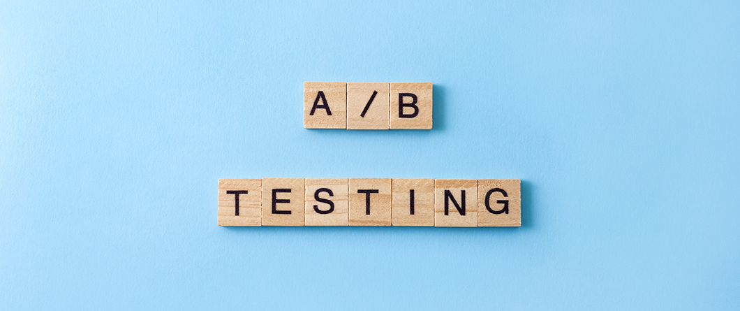 AB Testing Strategy | Evok Advertising Wooden letter tiles spell'A/B' above 'TESTING' on a light blue background.